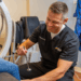 Doctor performing an ortho exam in an exam room.