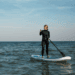 woman on a stand up paddle board on the ocean.