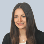 Professional headshot of a smiling woman.